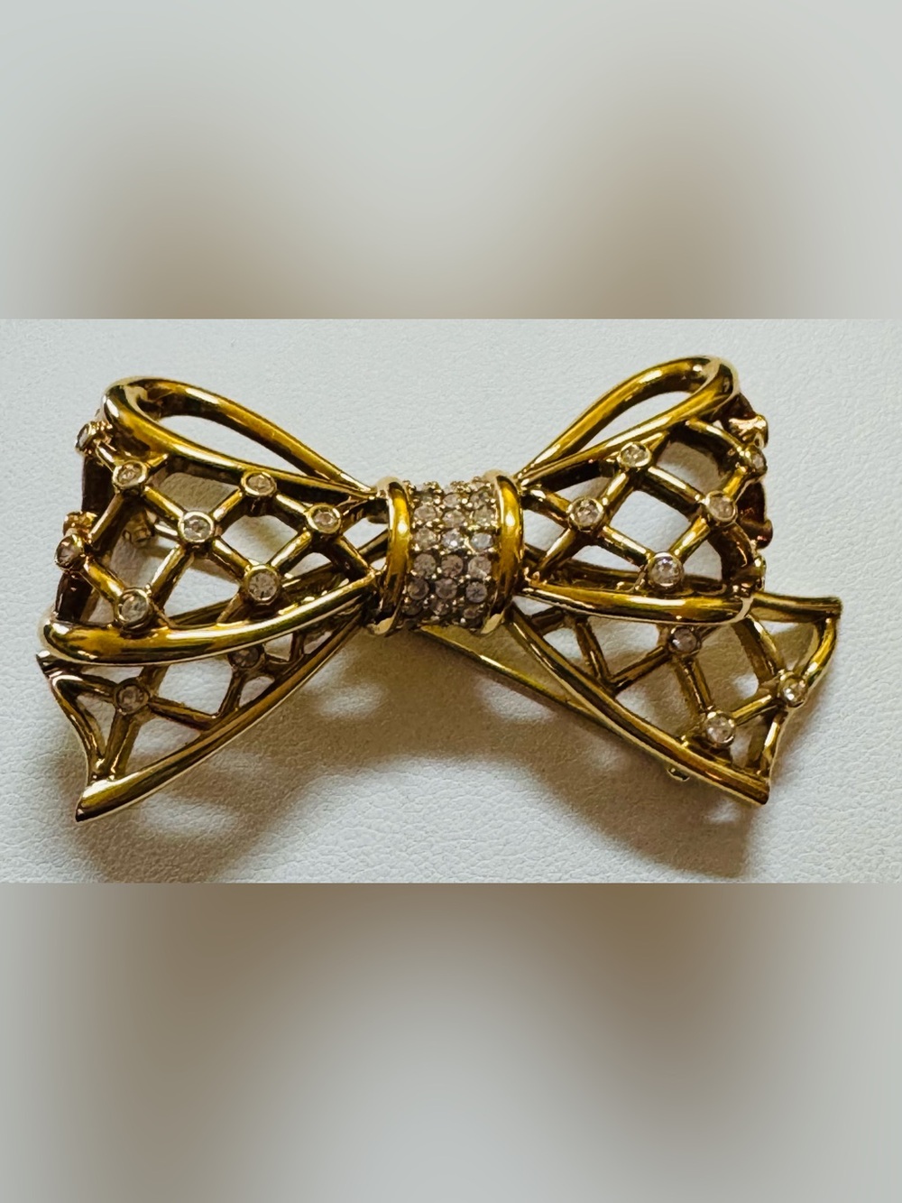 Swarovski crystal gold tone bow brooch